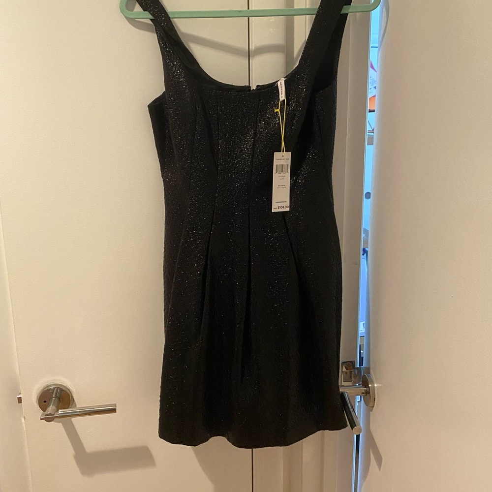 Bcbg mini dress with shiny textured fabric. Size 6 never worn with tags on